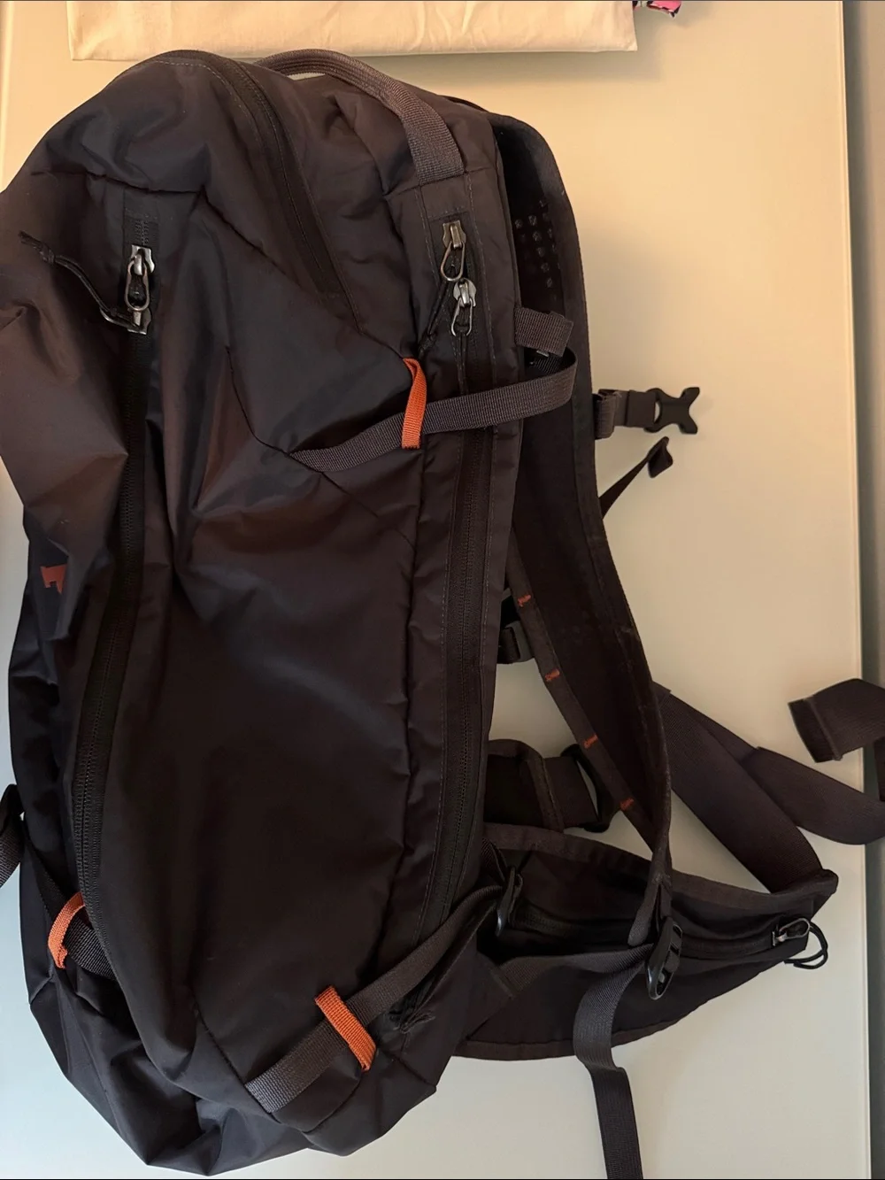 Patagonia Black Backpack with Orange Logo and Accents